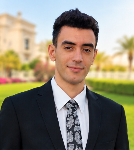 Mohamed Sonbol wearing a suit and paisley tie